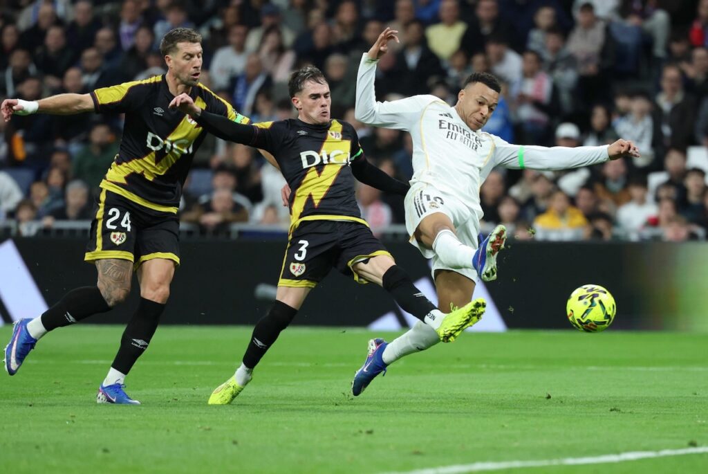 Mbappe penalty earns Real Madrid late win over nine man Rayo