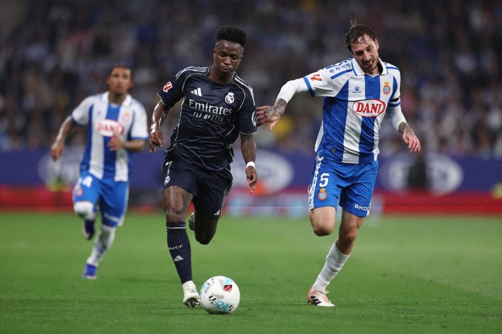 Vinicius double delays Barca title as Real Madrid down Espanyol