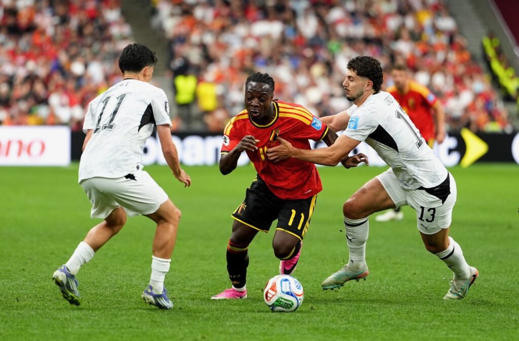 Belgium into World Cup last 32 with New Zealand rout