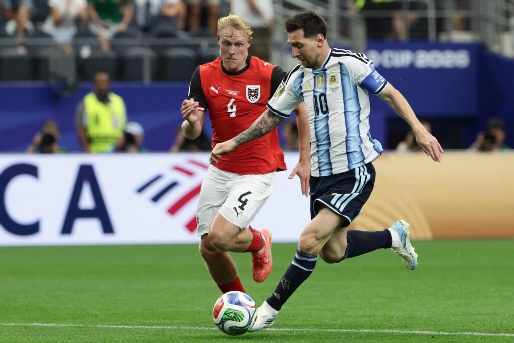 Magic Messi makes World Cup history to send Argentina into last 32