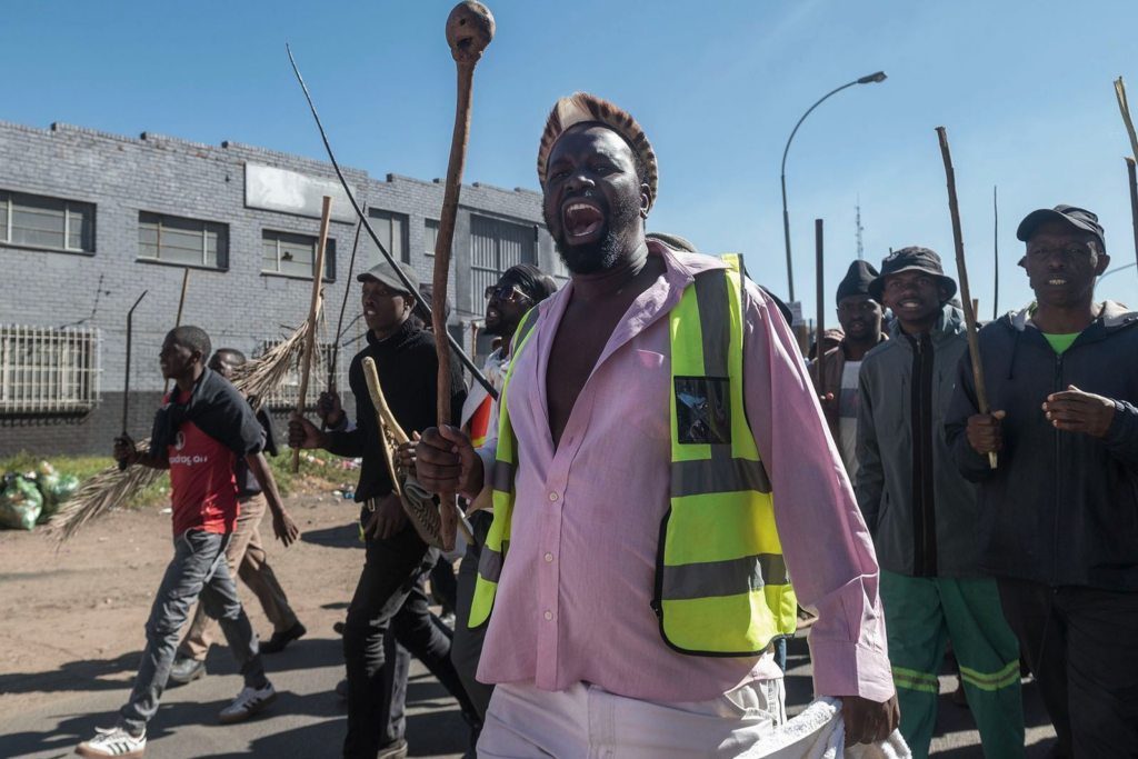 Protesters, made up of community members and civic organisations, march to companies alleged to be employing foreign nationals in Boksburg and Benoni, east of Johannesburg, on 8 June. (Photo: Leon Sadiki)