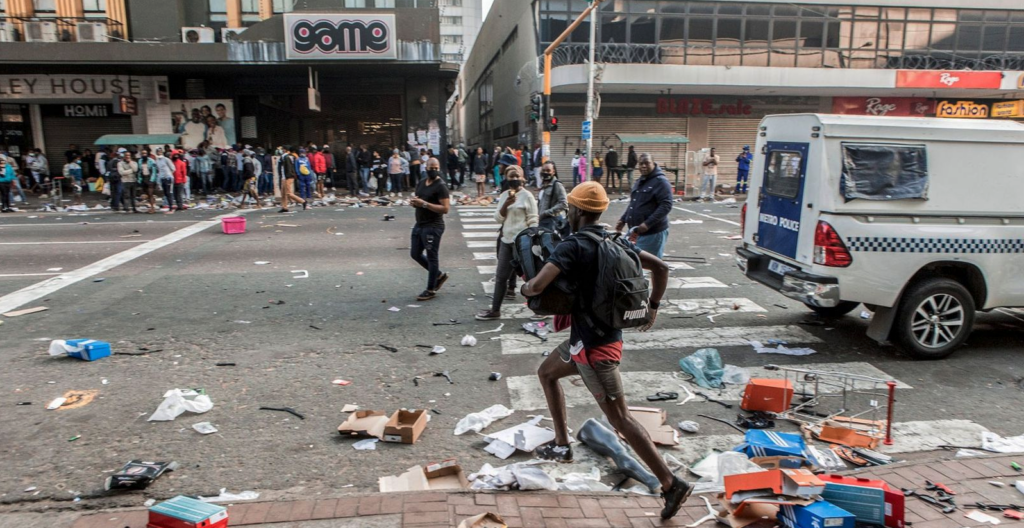 A looter in West Street, Durban during the July 2021 riots. (Photo: Samora Chapman)