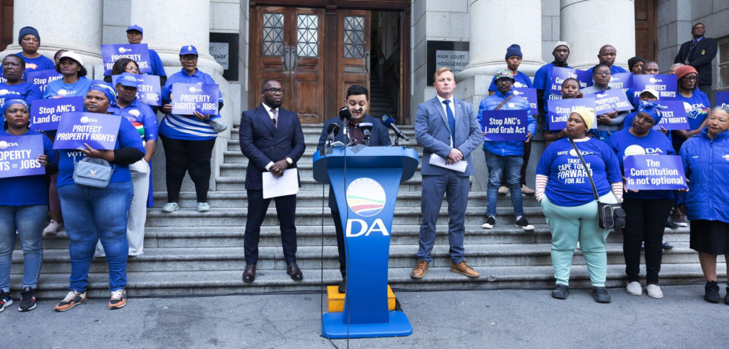 Ashor Sarupen address Democratic Alliance (DA) supporters before the Expropriation Act Hearing outside the Western Cape High Court on August 03, 2026 in Cape Town, South Africa. The DA is asking the Western Cape High Court to declare the Expropriation Act invalid and unconstitutional, aiming to protect homeowners, farmers, and business owners. (Photo: Gallo Images/Misha Jordaan)