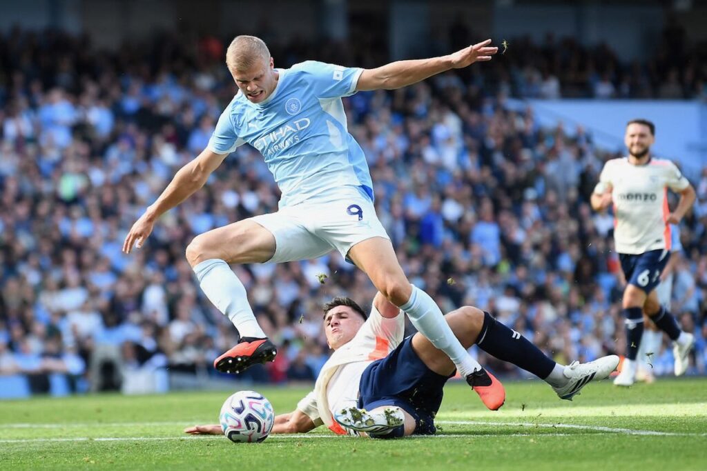 Haaland heads unconvincing Man City top of Premier League