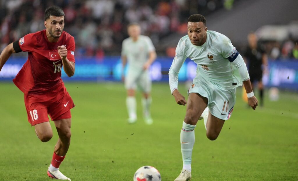 Mbappe scores but suffers knee injury as Zidane gets debut France win